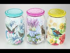 three colorful jars with birds and flowers painted on them