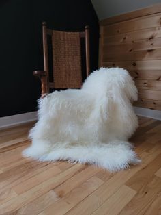 Mongolian 3-pelt sheepskin throw shown on rocking chair with a black batten wall on hickory wood floor Grey Sheepskin Rug, White Sheepskin Rug, Sheepskin Chair, Autumn Interior, White Throw Blanket, Sheepskin Throw, Fur Rug, Sheep And Lamb, Fur Throw Blanket