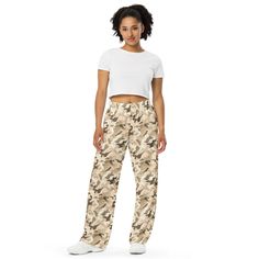 Upgrade your loungewear with our All-Over-Print Unisex Wide-Leg Pants, designed for ultimate comfort and style. These best-selling pants effortlessly blend fashion with function, making them perfect for everything from cozy pajamas to trendy streetwear. Whether you're lounging at home or stepping out, their super soft, stretchy fabric ensures comfort in every move. Crafted with premium knit mid-weight jersey fabric, these pants feature a relaxed unisex fit and an adjustable elastic waistband with a white drawstring for added comfort. Plus, the practical side pockets make them ideal for daily wear. Choose to wear them on the waist or hips for a customizable fit. The fabric's OEKO-TEX 100 standard certification guarantees safe, eco-friendly material that's gentle on the skin. Whether you're Comfy Pajama, Cozy Pajamas, Trendy Streetwear, Pajamas Comfy, Pj Pants, Elastic Waist Pants, Pantalon Large, Camo Print, Waist Pants