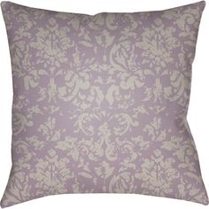 a purple and white pillow with an ornate design on the front, sitting against a white background