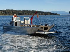 a man driving a boat in the water