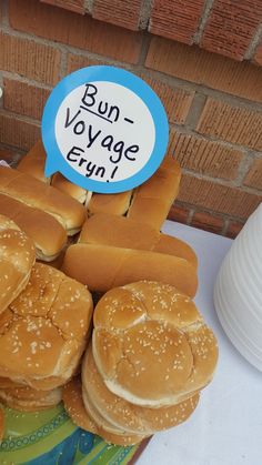 buns and hot dogs on a table with a sign that says bun voyage brun