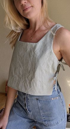 a woman standing in front of a counter top