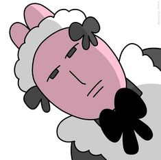 a black and white sheep with a pink face