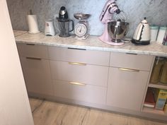 a kitchen counter with various appliances on it