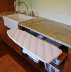 an image of a kitchen with a sink and dishwasher on the appliance