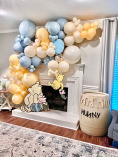 a living room filled with balloons and winnie the pooh