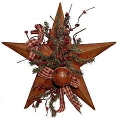 a wooden star with christmas decorations on it's sides and a bow around the center