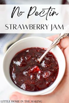 a hand holding a bowl of strawberry jam with the title overlay reads no pectin strawberry jam