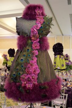 a dress made out of feathers and flowers