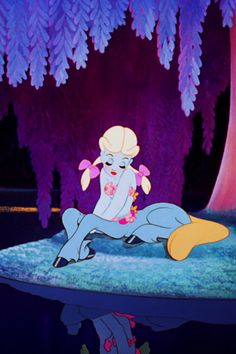 an animated character is laying on the ground in front of some trees and purple lights