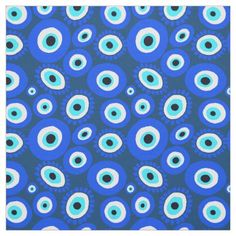 an abstract blue and white pattern with large, round eyes on it's surface