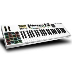 an electronic keyboard with many different keys and numbers on the front, sitting upright against a white background