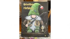 a book with an image of a gnome holding a fishing rod