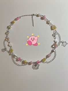 beaded necklace featuring star and kirby hand drawn shrinky dink charms + chains pallete inspired by the character kirby! approximately 49.5cm extender chain(8cm) included 🌷 one of a kind! but remakes are avail if sold out, pls msg me! feel free to pm me w questions! Shrinky Dink Charms, Anime Necklace, Gold Star Pendant, Shrinky Dink, Homemade Jewelry, Star Pendant, Gold Stars, Kirby, Bead Crafts