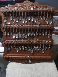 a wooden rack with spoons hanging from it