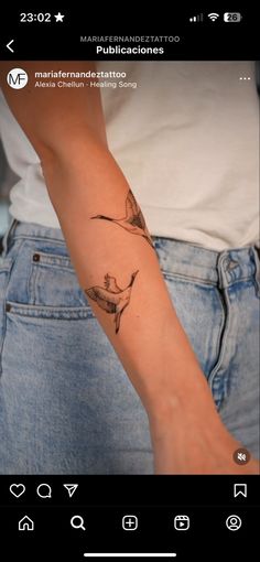 a woman's arm with a tattoo on the left side of her right arm