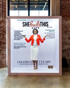 a woman in an orange blazer and white dress is on the cover of she put this city magazine