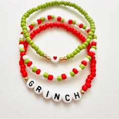 three bracelets with the word grin written on them and beaded beads in different colors