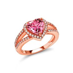 a pink heart shaped ring with diamonds around it