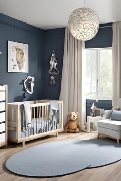 a baby's room with blue walls and white furniture