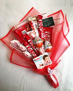 a bunch of candy wrapped in red ribbon