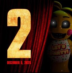 the number two is in front of a red curtain with a cartoon character next to it