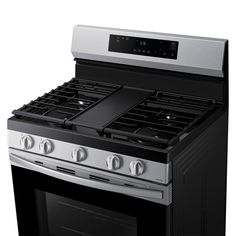 a black and silver stove top oven on a white background