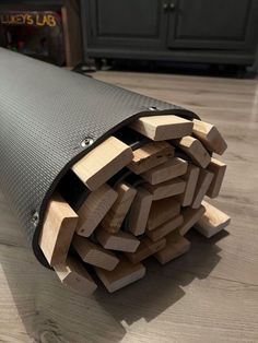 a pile of wood sitting on top of a wooden floor