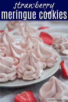 strawberry meringue cookies on a plate with strawberries