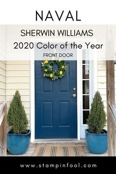 a blue front door with two potted plants next to it and the words naval shewin williams's color of the year