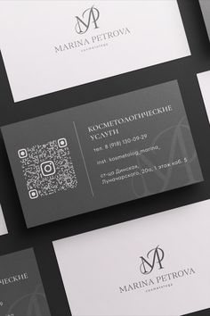 several business cards with the letter m on them