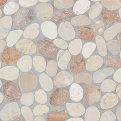 a stone floor with several different colored stones on it