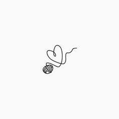 a black and white drawing of a ball of yarn with a heart in the middle