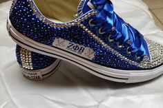 Made to order customized bedazzled converse. This shoe is a Universal men/women shoe, runs a little big. Jewel Jeans, Quince Shoes, Bedazzled Converse, Bedazzled Shoes Diy, Bedazzled Shoes, Blue Crocs, Tie Sneakers, Quinceanera Planning, Shoe Designs