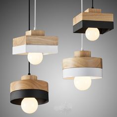 three wooden and white lights hanging from the ceiling