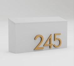 a white box with the number twenty five in gold on it's front and side