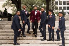 a group of men in suits standing on steps