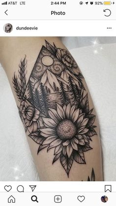 a black and white photo of a sunflower tattoo