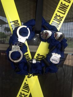 the police wreath is decorated with handcuffs, sunglasses and other items that have been placed on it