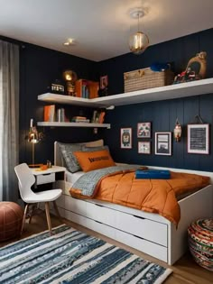 a bedroom with a bed, desk and bookshelves on the shelves above it