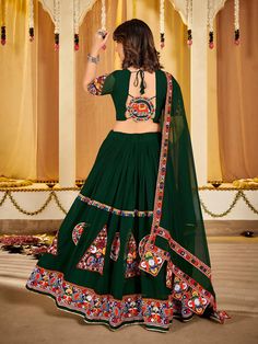 Captivate the spirit of Navratri with this stunning green Georgette lehenga choli dupatta set! This enchanting ensemble features intricate embroidery and mirror work, creating a mesmerizing look that reflects the vibrancy of the festival. Versatility in Shades and Fabrics: The elegant Georgette fabric drapes beautifully, while the green color embodies the fresh energy of the season. Traditional Craftsmanship: Each stitch is a testament to the expertise of Indian artisans, ensuring a piece that's both beautiful and heirloom-worthy. Style Guide: Pair this lehenga with statement jewelry and traditional footwear to complete your dazzling Navratri outfit. Cultural Significance: Celebrate the nine divine forms of Durga in style with this culturally significant ensemble. Comfort & Sustainability: Dandiya Dress, Garba Outfit, Navratri Lehenga, Garba Dress, Dress Saree, Lehenga Saree Design, Navratri Dress, Long Frock Designs, Georgette Lehenga