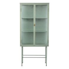 a green metal cabinet with two doors