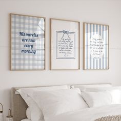 three framed pictures hang on the wall above a bed