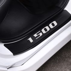 the back end of a white car with black and white lettering that says i 500