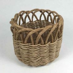 a wicker basket is shown on a white background