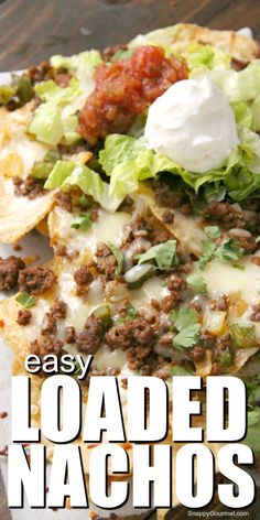 an easy loaded nacho with lettuce, cheese and tomato sauce on top