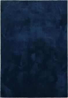 a dark blue rug on a white background