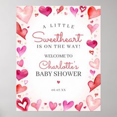 a pink and red baby shower sign with hearts on the bottom that says, a little sweetheart is on the way welcome to charlotte's baby shower