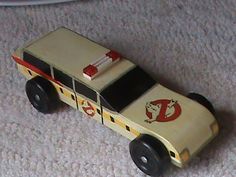 a toy firetruck is sitting on the floor